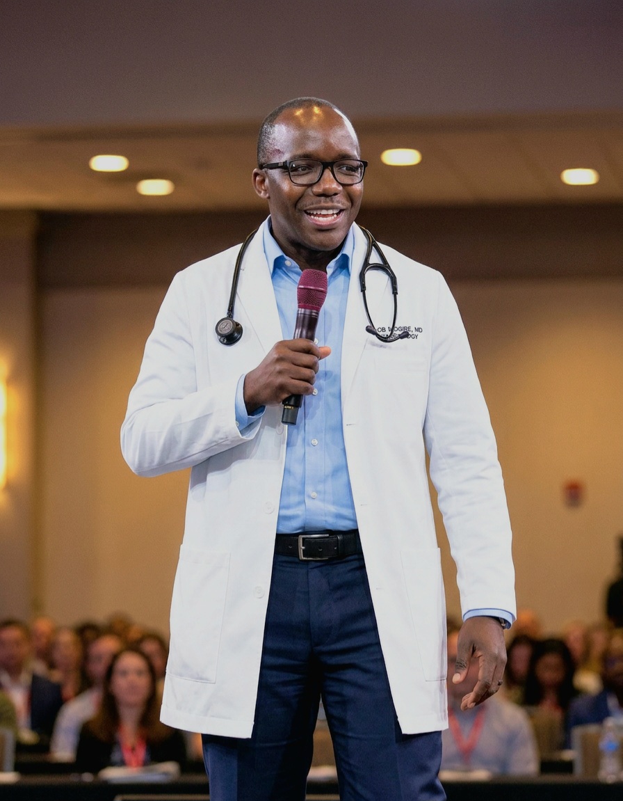 Dr. Job Mogire, MD, FACP, FACC — speaking at a medical conference